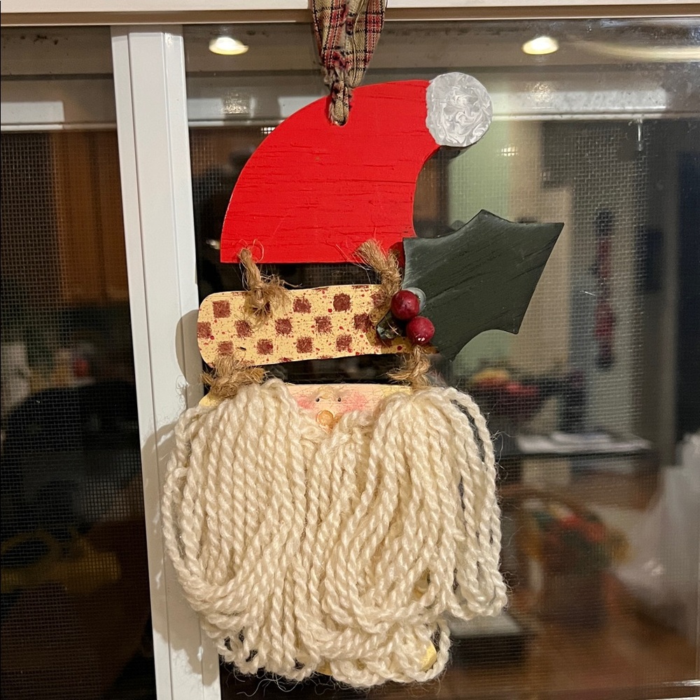 Festive Santa Claus Ornament with Red Hat